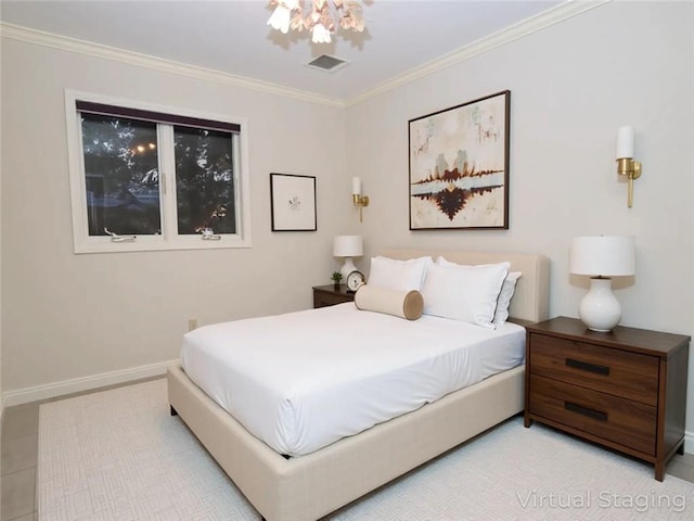 bedroom with ornamental molding and baseboards