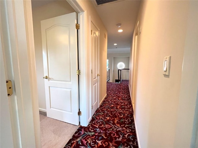 hall with carpet flooring and recessed lighting