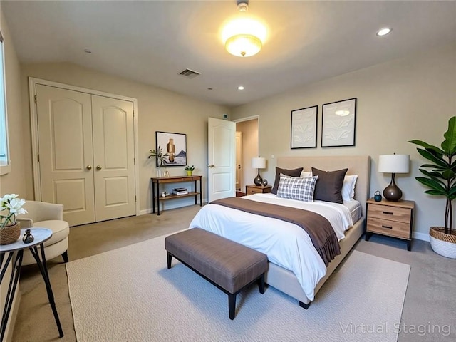 carpeted bedroom featuring a closet, baseboards, recessed lighting, and vaulted ceiling