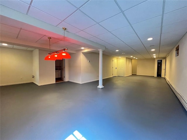 finished below grade area featuring recessed lighting, baseboards, and a drop ceiling