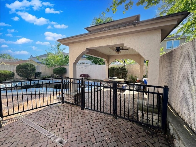 view of patio / terrace with ceiling fan and a fenced backyard