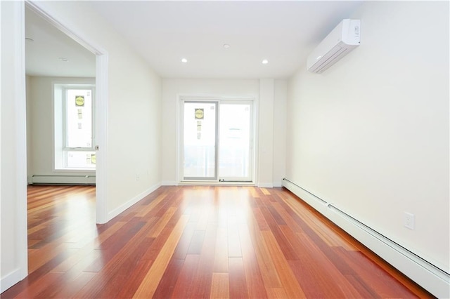 1721 W 6th St Unit 2A, Brooklyn, NY 11223 - unfurnished room with baseboard heating, a wall mounted air conditioner, wood finished floors, baseboards, and recessed lighting