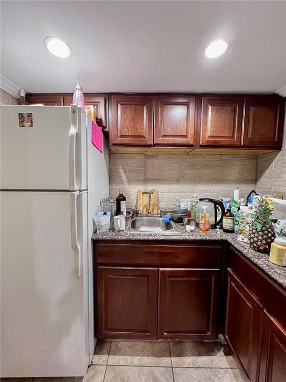 1202 E 46th St, Brooklyn, NY 11234 - kitchen with freestanding refrigerator, a sink, light tile patterned floors, tasteful backsplash, and stone counters