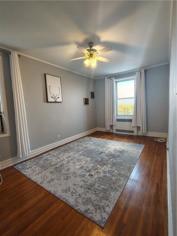 2195 E 22nd St Unit 5C, Brooklyn, NY 11229 - spare room featuring a ceiling fan, baseboards, wood finished floors, and crown molding