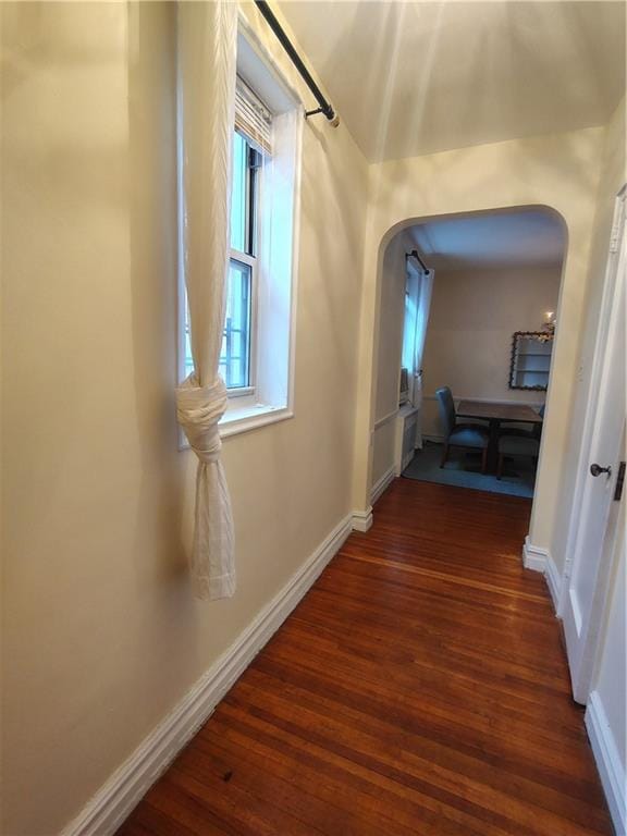 2195 E 22nd St Unit 5C, Brooklyn, NY 11229 - corridor with arched walkways, dark wood finished floors, and baseboards