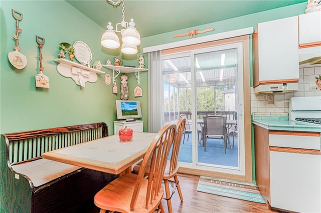27 Frederick St, Staten Island, NY 10314 - dining room with a chandelier and light wood finished floors