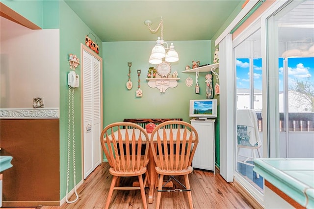 27 Frederick St, Staten Island, NY 10314 - dining space featuring light wood-style floors and a chandelier