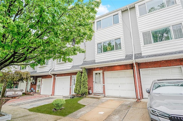 27 Frederick St, Staten Island, NY 10314 - townhome / multi-family property with brick siding and an attached garage