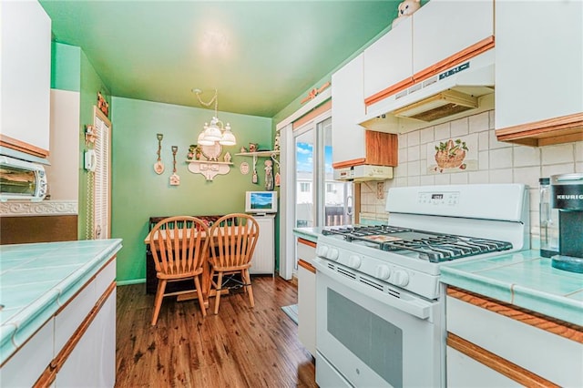 27 Frederick St, Staten Island, NY 10314 - kitchen with white range with gas cooktop, tile countertops, white cabinetry, and under cabinet range hood
