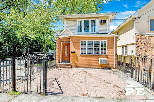 2758 E 26th St, Brooklyn, NY 11235 - view of front of home with brick siding and a gate