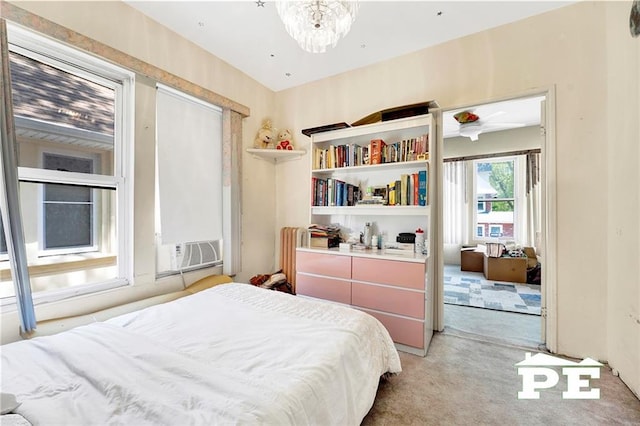 2758 E 26th St, Brooklyn, NY 11235 - bedroom with light colored carpet, a chandelier, and cooling unit
