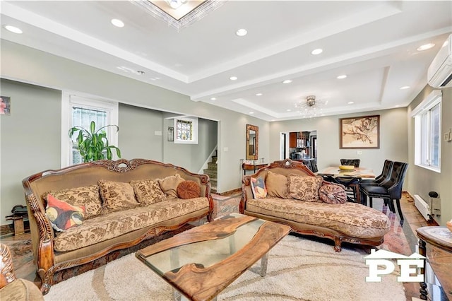 2758 E 26th St, Brooklyn, NY 11235 - living room featuring stairway, a raised ceiling, recessed lighting, a wall mounted air conditioner, and a baseboard radiator