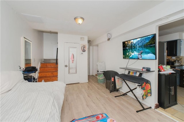 bedroom featuring light wood finished floors