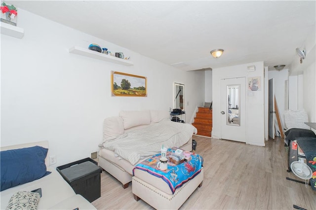 bedroom with light wood-style floors