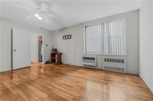 1165 54th St Unit 5U, Brooklyn, NY 11234 - unfurnished room featuring radiator heating unit, wood finished floors, and ceiling fan