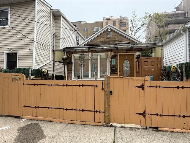 1120 Banner Ave, Brooklyn, NY 11235 - view of front facade with a gate and a fenced front yard