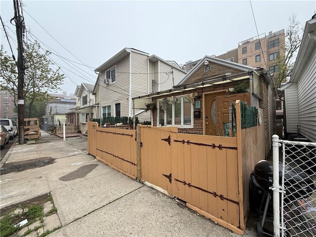 1120 Banner Ave, Brooklyn, NY 11235 - view of home's exterior with a gate