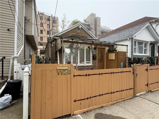 1120 Banner Ave, Brooklyn, NY 11235 - view of front of house with a gate and a fenced front yard