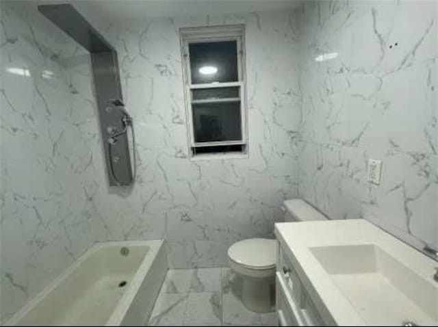 full bathroom with marble look tiles, toilet, and vanity