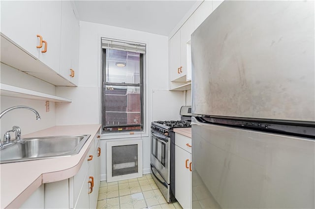 3101 Ocean Pkwy Unit 3H, Brooklyn, NY 11235 - kitchen featuring stainless steel appliances, open shelves, a sink, light countertops, and white cabinets
