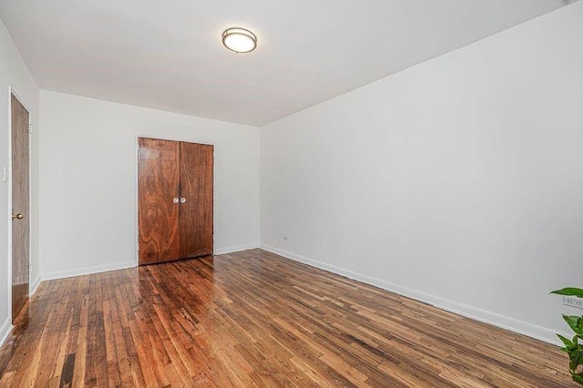 3101 Ocean Pkwy Unit 3H, Brooklyn, NY 11235 - unfurnished bedroom featuring wood finished floors, baseboards, and a closet