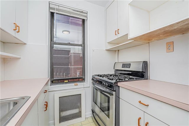 3101 Ocean Pkwy Unit 3H, Brooklyn, NY 11235 - kitchen featuring stainless steel range with gas stovetop, a sink, light countertops, and white cabinets