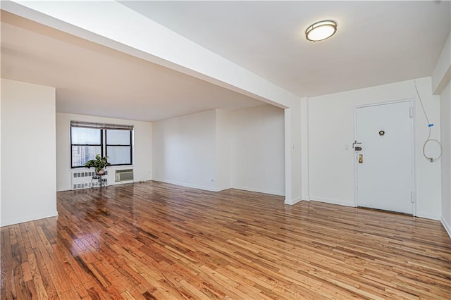 3101 Ocean Pkwy Unit 3H, Brooklyn, NY 11235 - unfurnished room with light wood-style floors and radiator heating unit