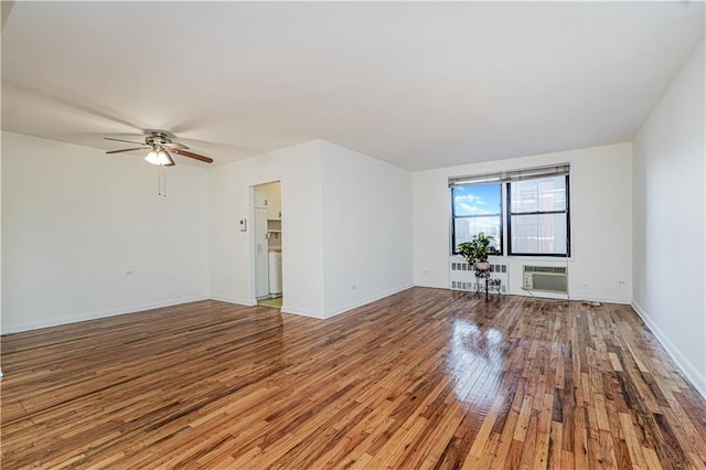 3101 Ocean Pkwy Unit 3H, Brooklyn, NY 11235 - unfurnished room with hardwood / wood-style flooring, a ceiling fan, a wall mounted air conditioner, and baseboards