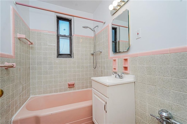 3101 Ocean Pkwy Unit 3H, Brooklyn, NY 11235 - bathroom featuring tile walls, shower / washtub combination, vanity, and a wainscoted wall