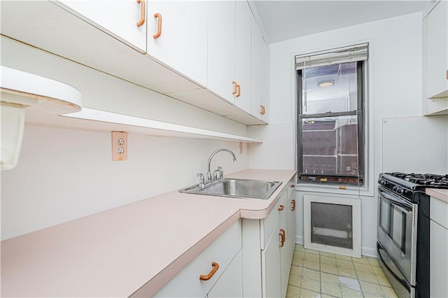 3101 Ocean Pkwy Unit 3H, Brooklyn, NY 11235 - kitchen featuring stainless steel gas stove, a sink, light countertops, and white cabinetry