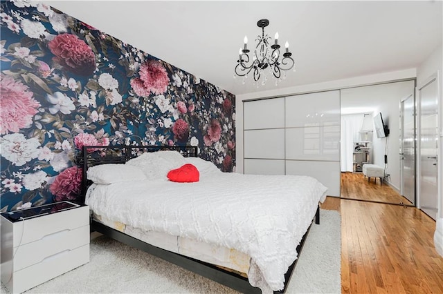 2546 E 13th St Unit A11, Brooklyn, NY 11235 - bedroom with a chandelier and wood finished floors