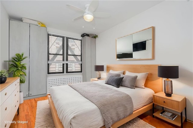 2546 E 13th St Unit A11, Brooklyn, NY 11235 - bedroom with light wood-style flooring and a ceiling fan