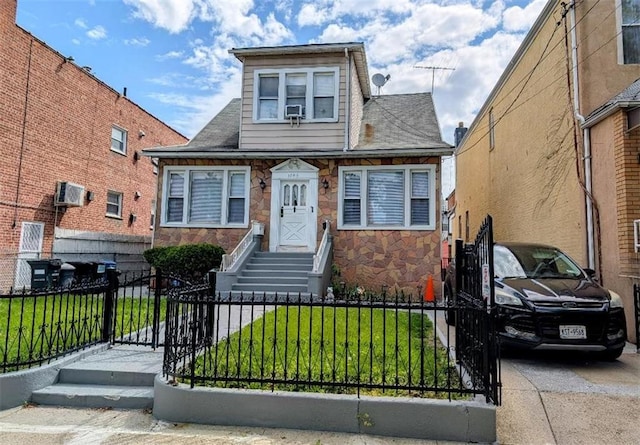 1765 W 12th St, Brooklyn, NY 11223 - view of front facade featuring stone siding and a shingled roof