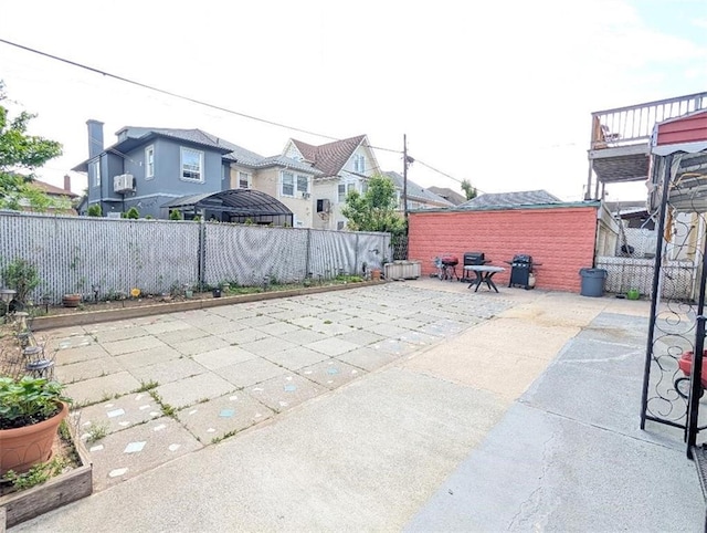 view of patio / terrace featuring a residential view and a fenced backyard