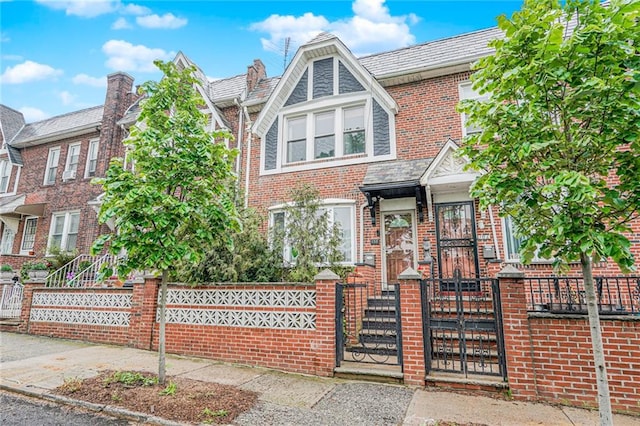 138 Wakeman Pl, Brooklyn, NY 11220 - view of front of property featuring a fenced front yard, brick siding, and a gate