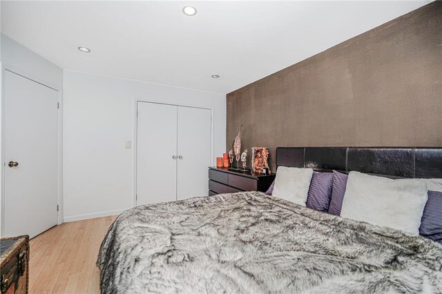 138 Wakeman Pl, Brooklyn, NY 11220 - bedroom with light wood-style flooring and recessed lighting