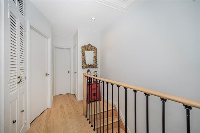138 Wakeman Pl, Brooklyn, NY 11220 - hall featuring light wood-type flooring, recessed lighting, and an upstairs landing