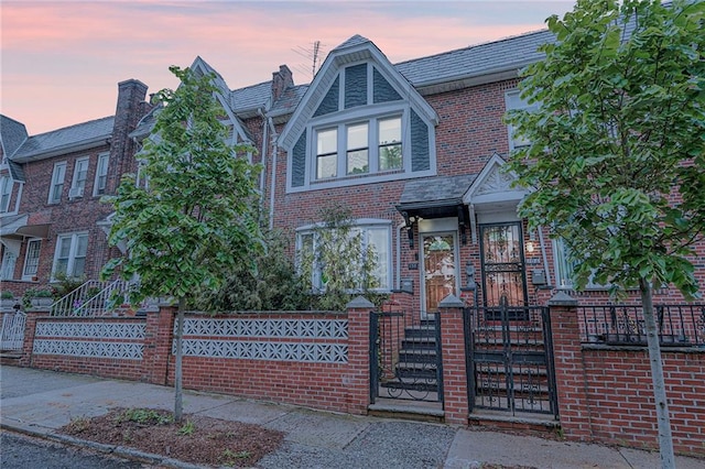 138 Wakeman Pl, Brooklyn, NY 11220 - view of front of home featuring a fenced front yard and brick siding