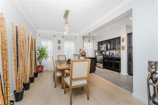 138 Wakeman Pl, Brooklyn, NY 11220 - dining area with light wood-style floors, ornamental molding, and recessed lighting