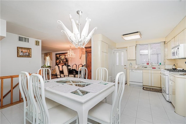 167 Bay 32nd St, Brooklyn, NY 11214 - dining area featuring a chandelier and light tile patterned floors