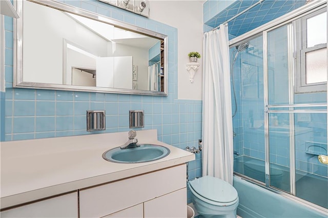 167 Bay 32nd St, Brooklyn, NY 11214 - bathroom with combined bath / shower with glass door, vanity, and tile walls
