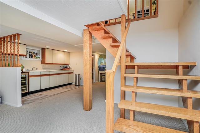 167 Bay 32nd St, Brooklyn, NY 11214 - staircase featuring bar with sink, carpet flooring, recessed lighting, and wine cooler