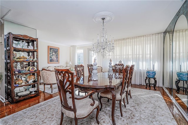 167 Bay 32nd St, Brooklyn, NY 11214 - dining area featuring wood finished floors, a chandelier, and ornamental molding