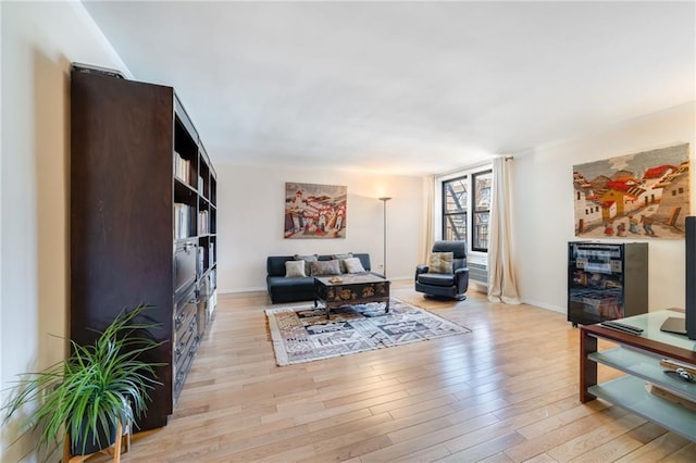 living room with light wood finished floors and baseboards