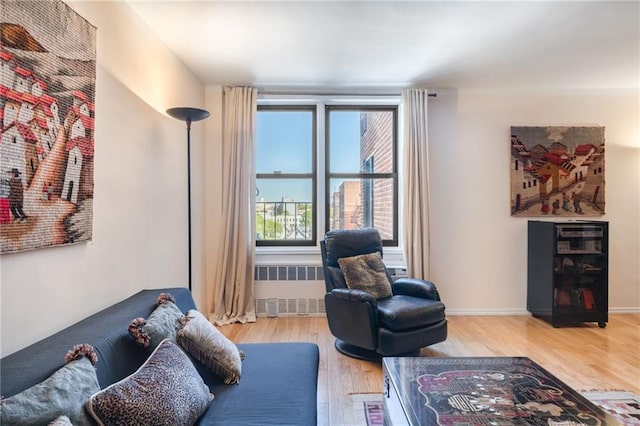 living room featuring radiator heating unit and wood finished floors