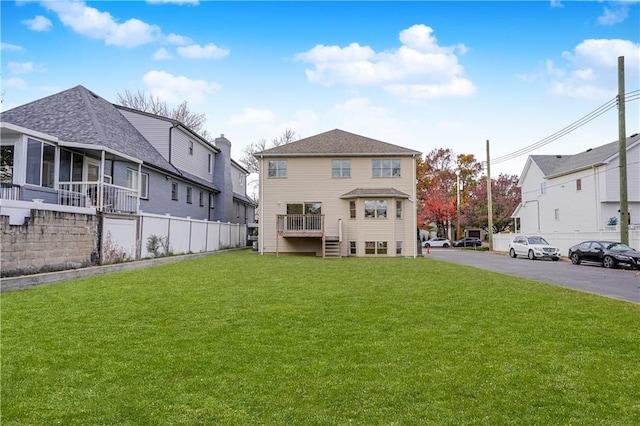 back of property with a yard