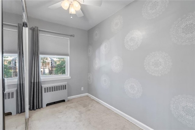 2472 Stuart St, Brooklyn, NY 11229 - unfurnished room with radiator heating unit, a ceiling fan, and carpet floors