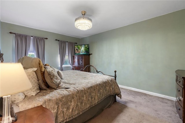 2472 Stuart St, Brooklyn, NY 11229 - carpeted bedroom featuring baseboards and a chandelier
