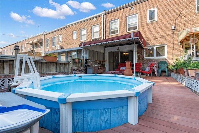 2472 Stuart St, Brooklyn, NY 11229 - view of pool with a wooden deck and a grill