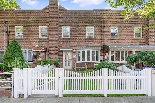 2472 Stuart St, Brooklyn, NY 11229 - view of front of house featuring brick siding and a fenced front yard